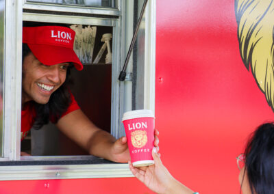 Serving a coffee drink from truck