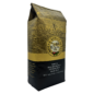 Angled view of one 24oz bag of Royal Kona Vanilla macadamia ten percent kona coffee, ground.